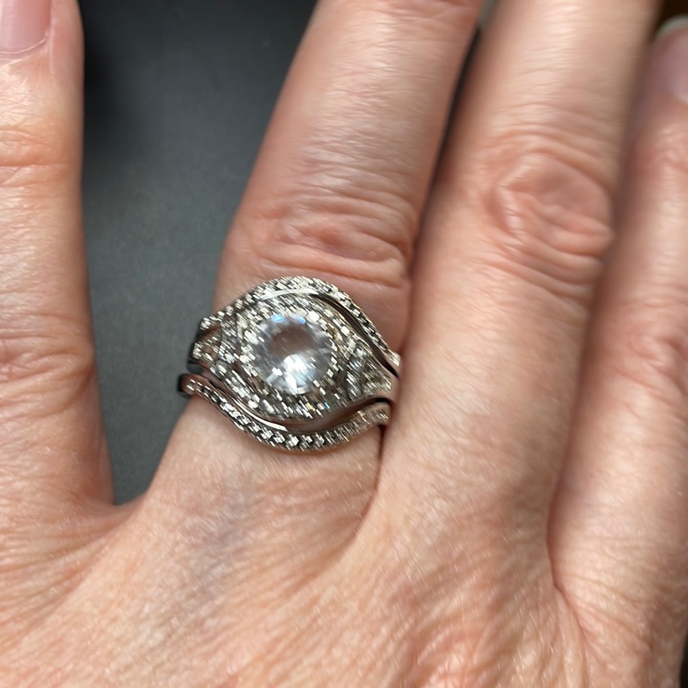 This is a 925 sterling silver ring with all clear stones.3 rings in one size 7.
